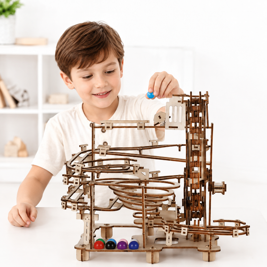 Child playing with a wooden marble run