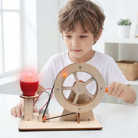 Boy cranking the DIY hand-crank generator to light an LED