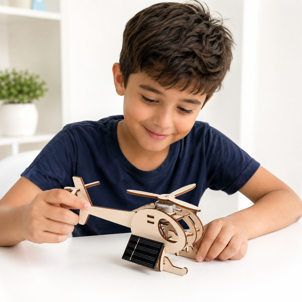 Child holding the assembled solar helicopter STEM kit
