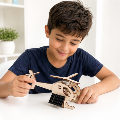Child holding the assembled solar helicopter STEM kit