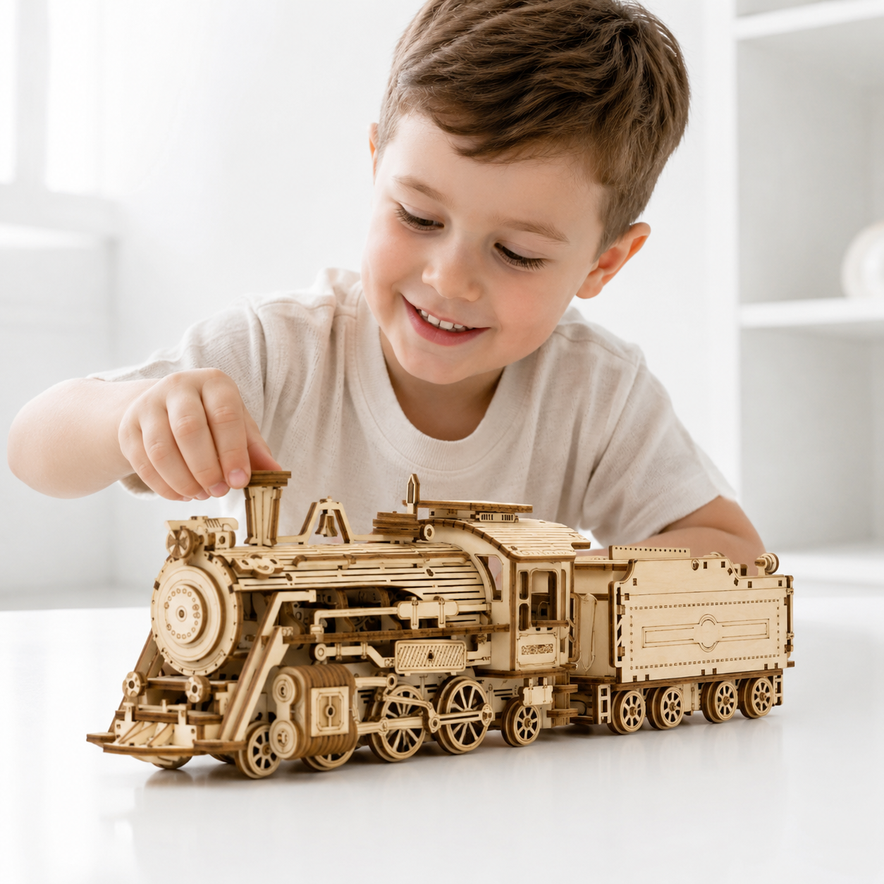 Child assembling the wooden steam train model