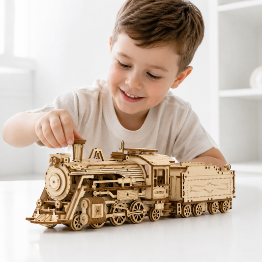 Child assembling the wooden steam train model