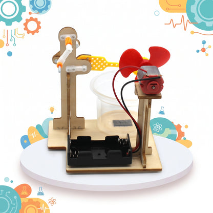 Side view of the bubble machine showing the motor, wiring and battery holder