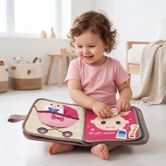 Toddler reading the soft cloth activity book